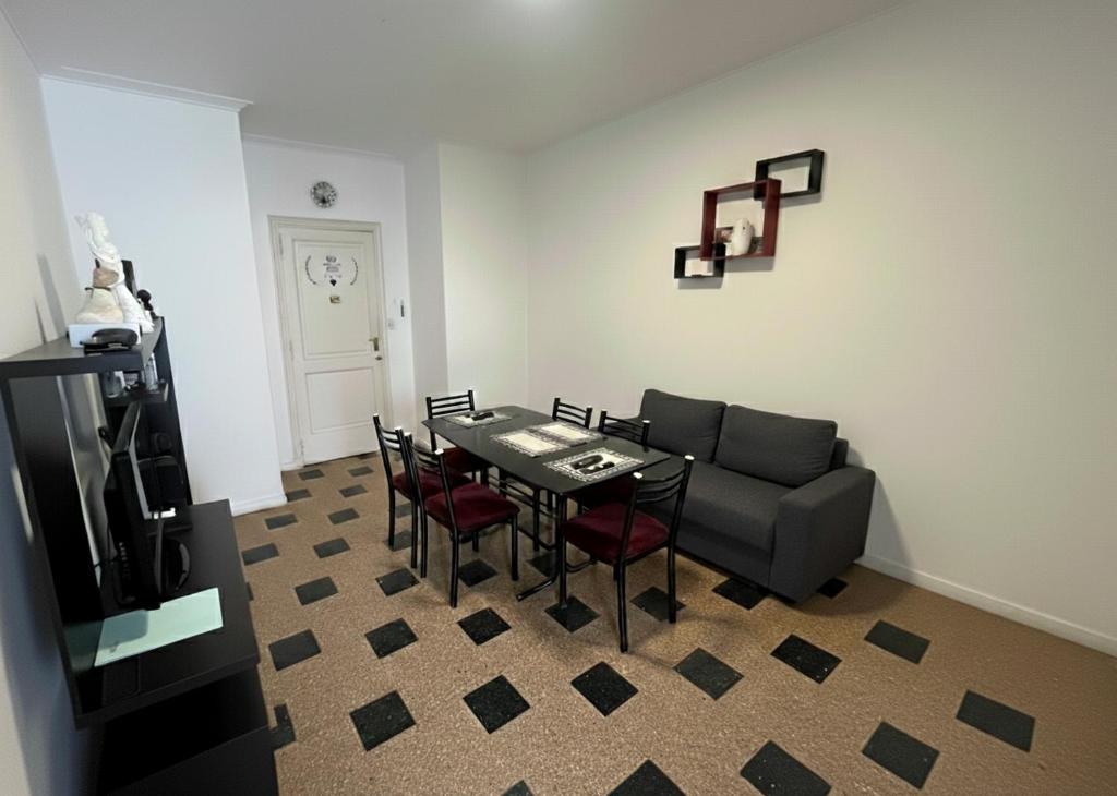 a living room with a table and a couch at Check and Home - Peatonal II - 6 Huéspedes en el Centro a 3 cuadras de la Playa in Mar del Plata