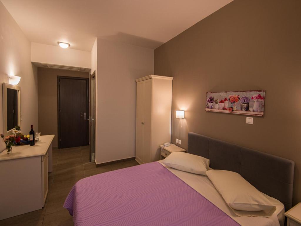 Postel nebo postele na pokoji v ubytování Harmony Hotel