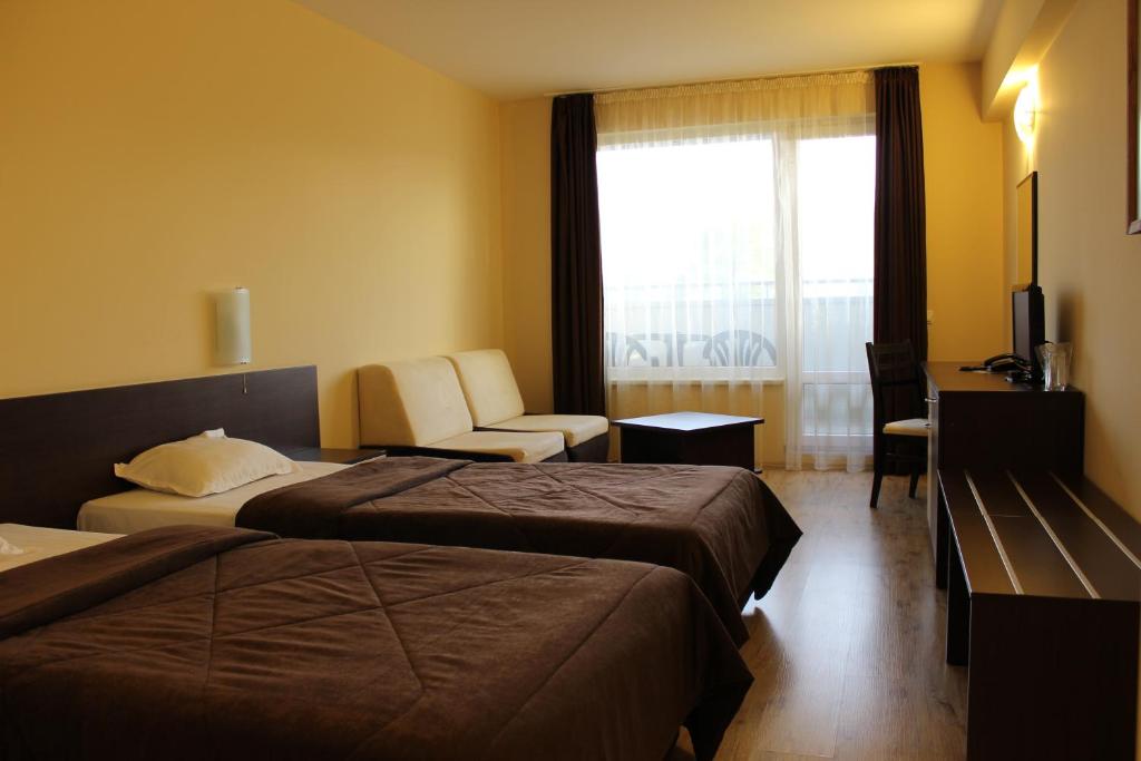Postel nebo postele na pokoji v ubytování Hotel Arena