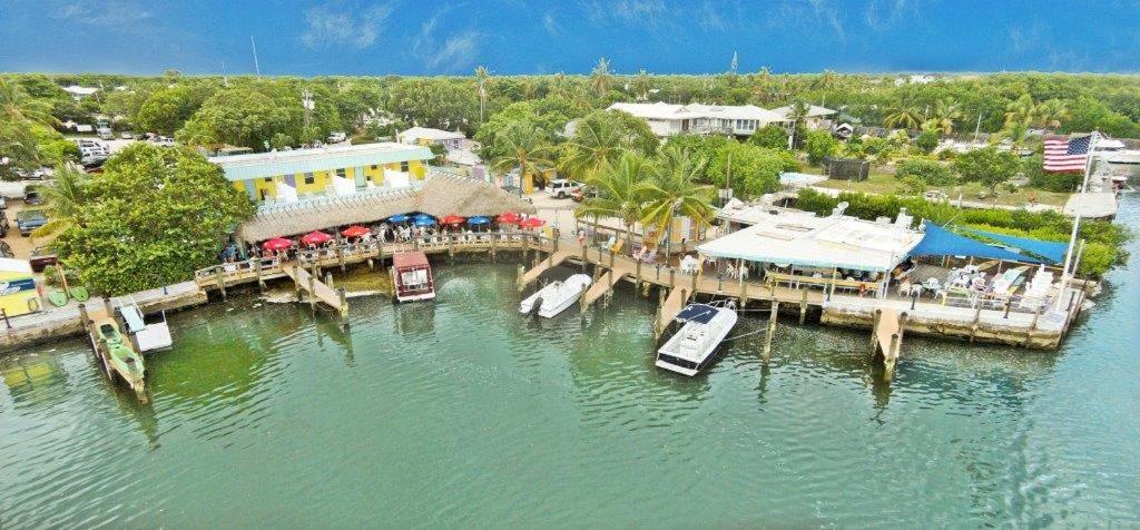 an aerial view of a pier with boats on the water at Snappers Key Largo in Key Largo