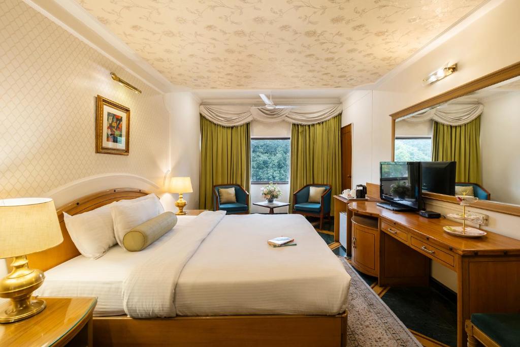 Ένα ή περισσότερα κρεβάτια σε δωμάτιο στο Hotel Kwality Regency