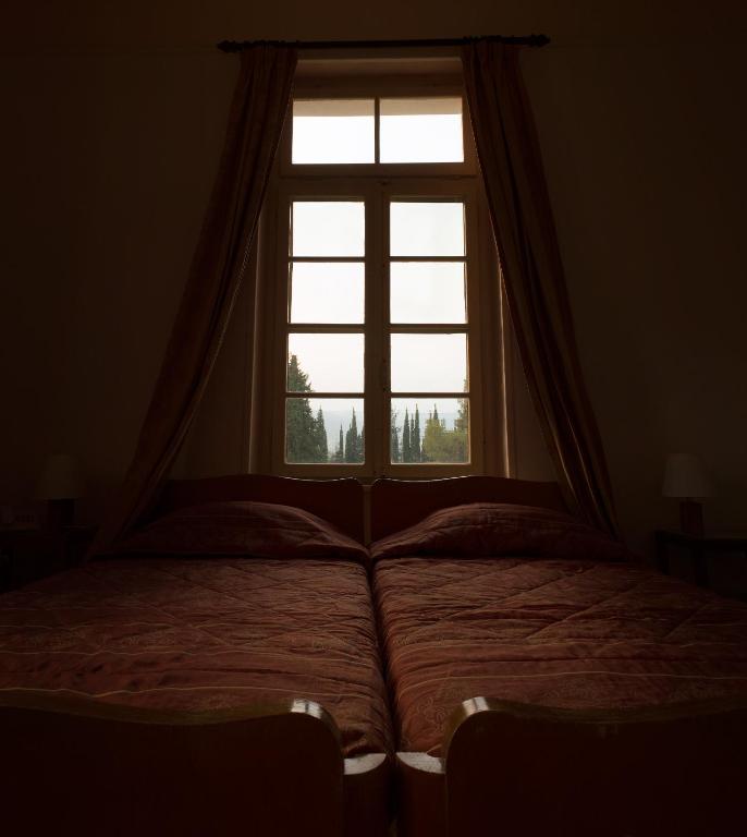 Postel nebo postele na pokoji v ubytování Hotel Oiti