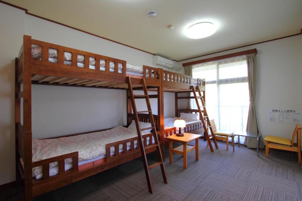 Postel nebo postele na pokoji v ubytování Guesthouse E-ne