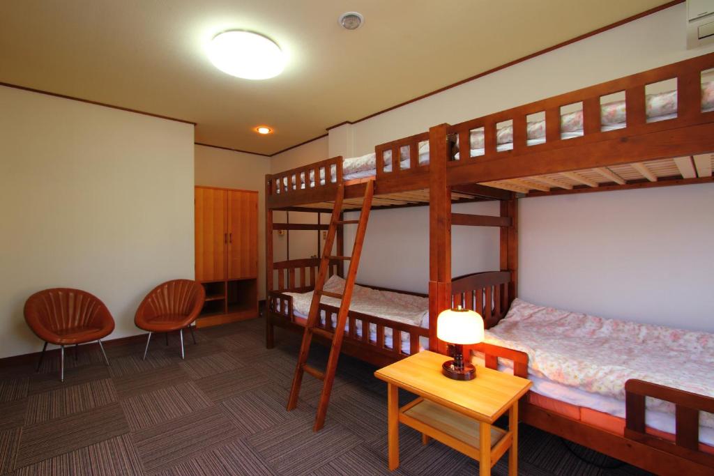 Postel nebo postele na pokoji v ubytování Guesthouse E-ne
