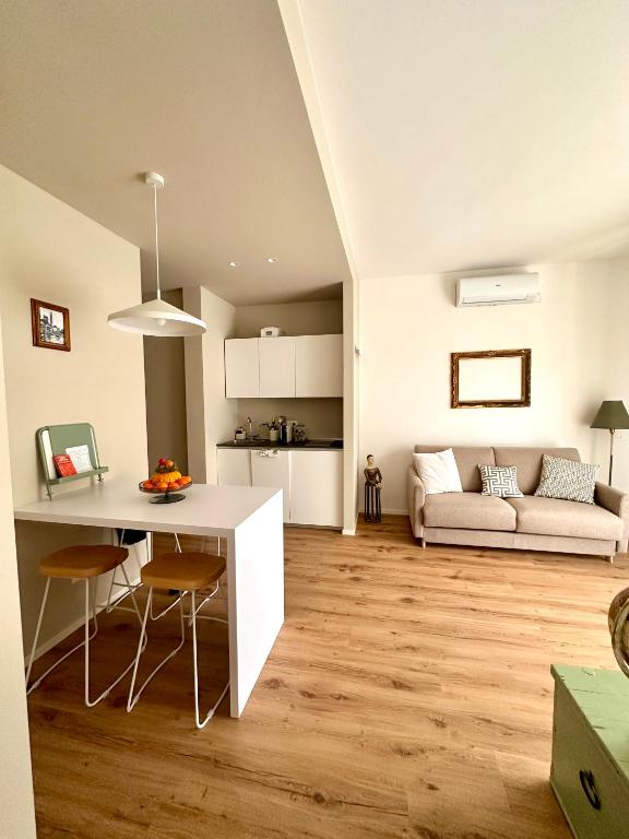 a kitchen and living room with a table and chairs at Stelle di Verona - Rigel in Verona