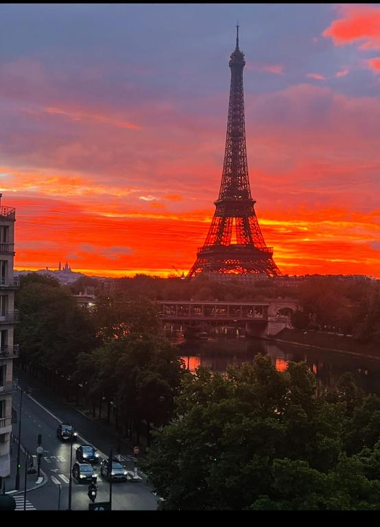 a view of the eiffel tower at sunset at Les Amoureux de Paris in Paris