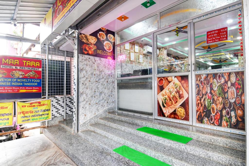 a fast food restaurant with stairs leading to the door at Hotel O Joy Maa Tara Hotel & Restaurant in kolkata