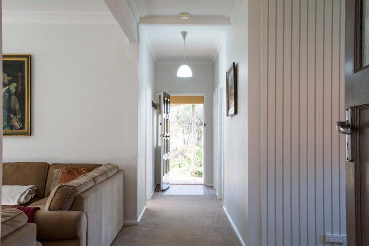 a living room with a couch and a window at 88 Morrisset in Bathurst