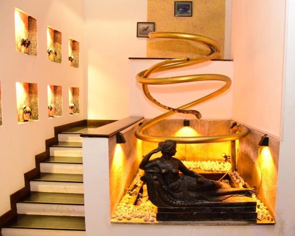 a staircase in a museum with a statue on it at cockpit tower at colombo airport in Katunayake