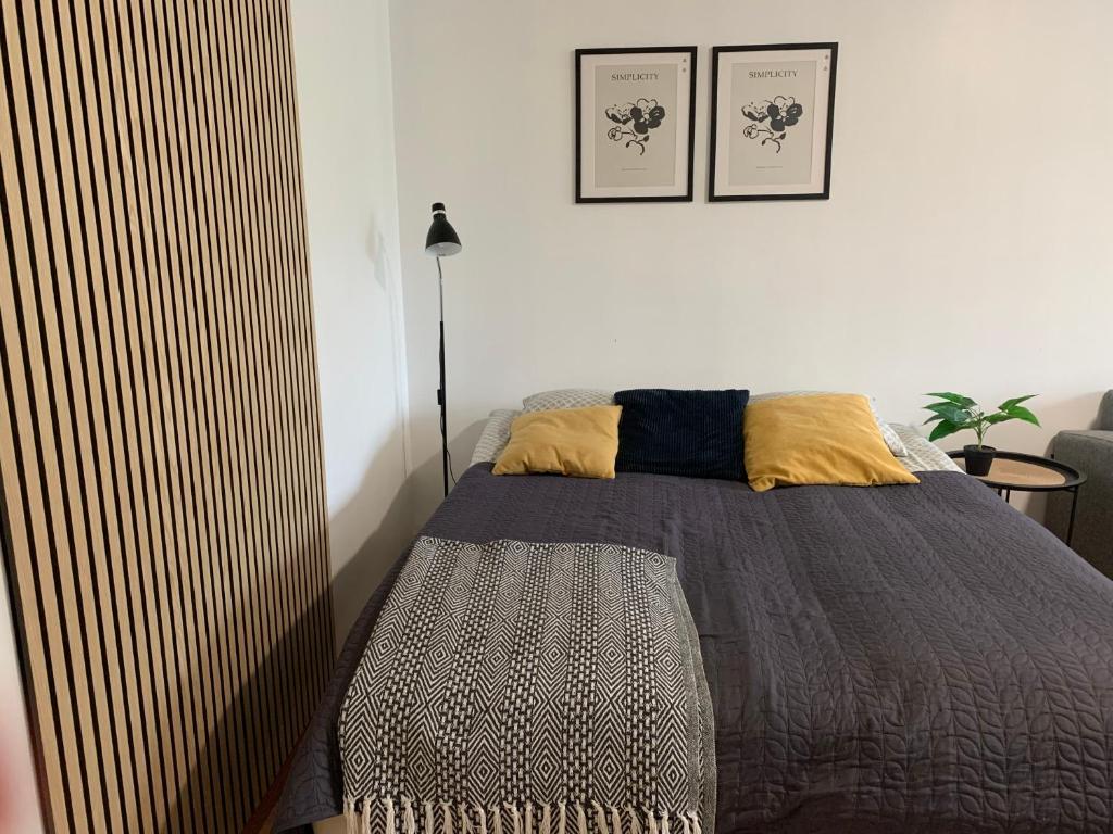 a bedroom with a bed with a bedspread at 2BR big Apartment A8, free parking on the street in Oulu