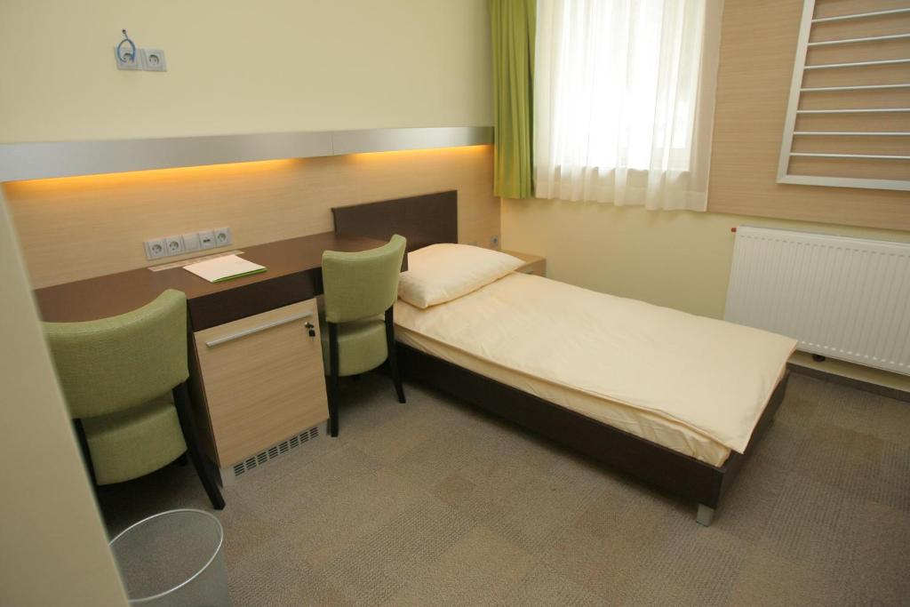 Postel nebo postele na pokoji v ubytování Hotel Center Pokljuka