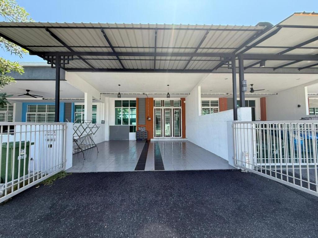 a porch of a home with awning over it at Villa Ammara Homestay in Ipoh