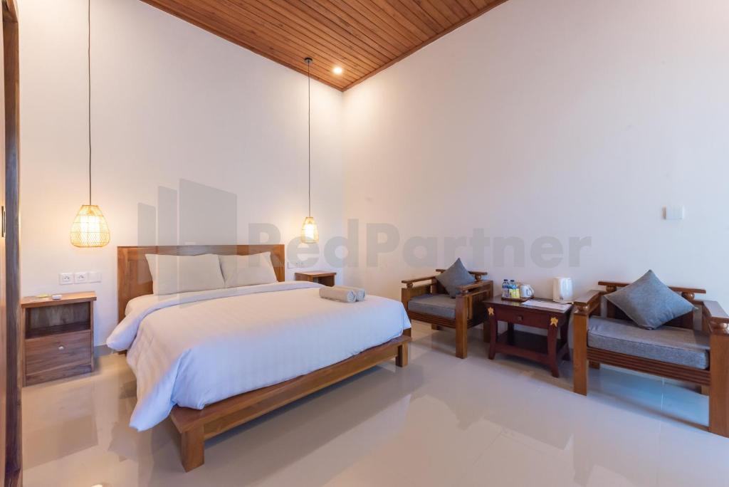 Una cama o camas en una habitación de Brisk Homestay Uluwatu RedPartner