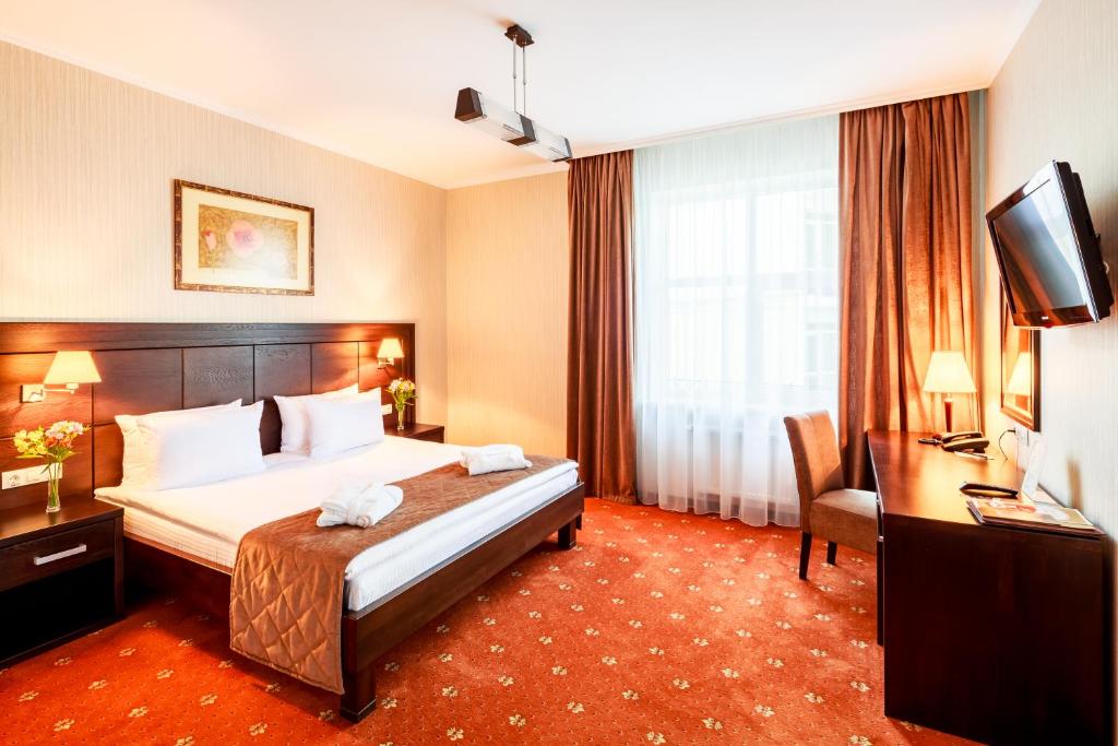 Ліжко або ліжка в номері Taurus Hotel & SPA