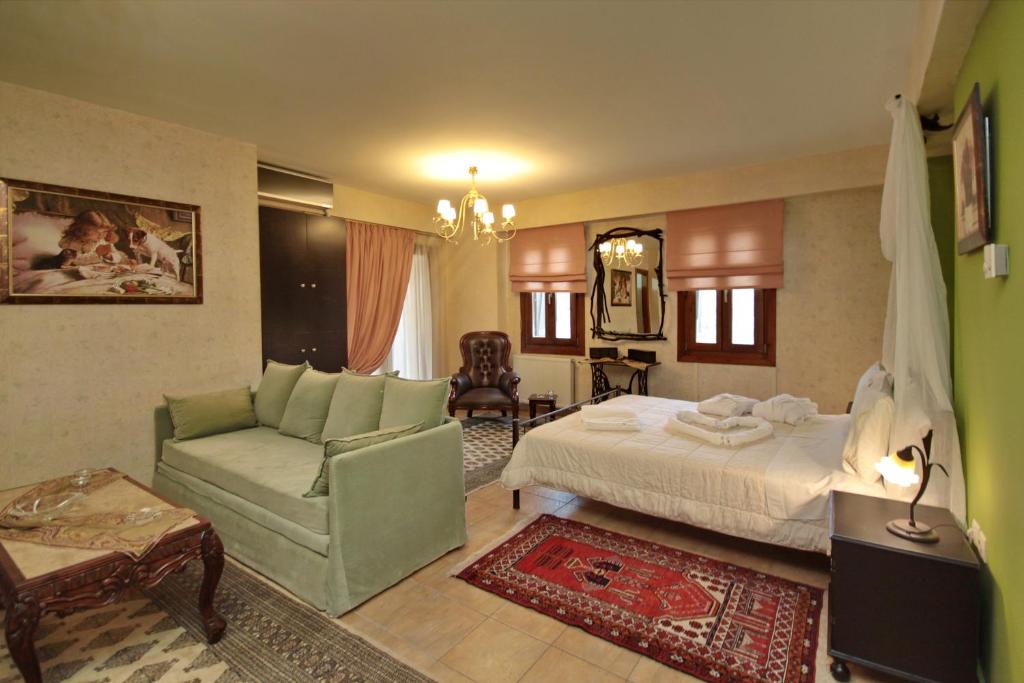 Postel nebo postele na pokoji v ubytování Menalia Villas & Suites ΚΤΗΜΑ ΚΟΥΜΠΟΥΡΗ