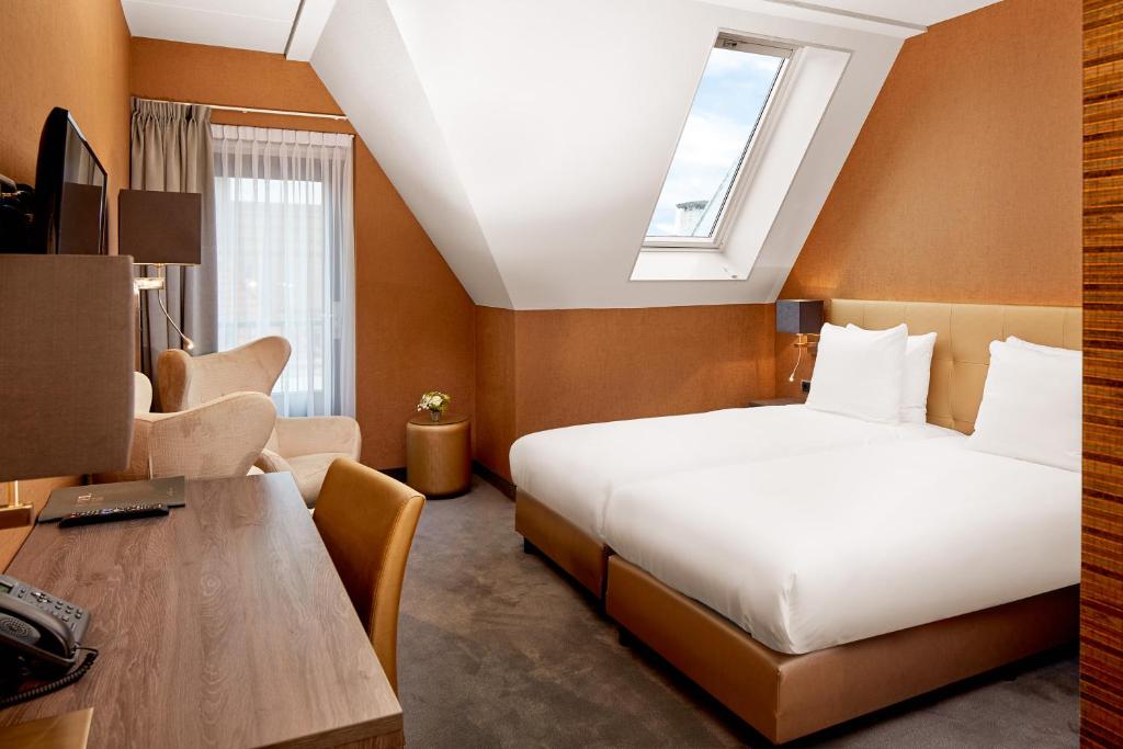 Postel nebo postele na pokoji v ubytování Hotel De Lindeboom