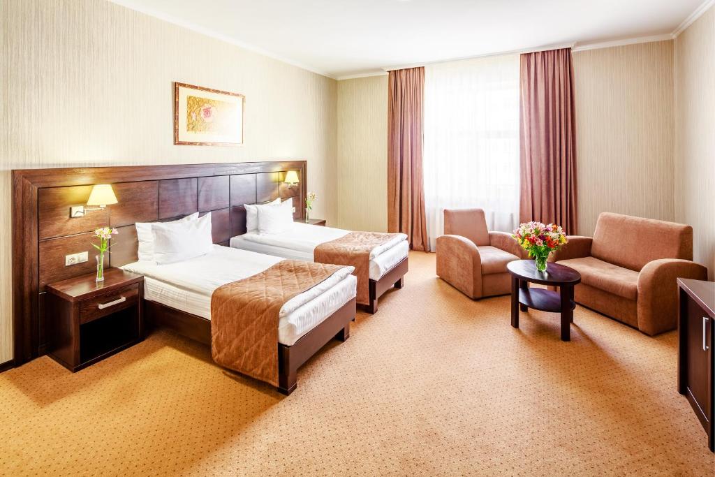 Ліжко або ліжка в номері Taurus Hotel & SPA