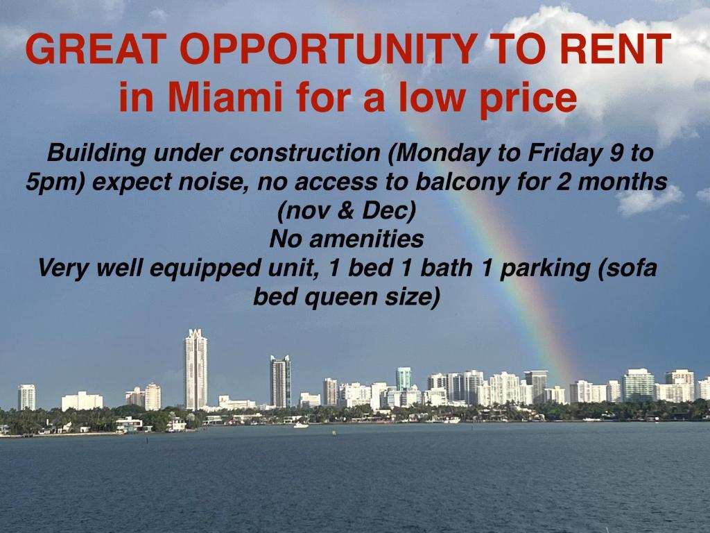 a city with a rainbow in the background at Unique Water Views, free Parking 1bed 1 bath Rooffornomads 416 in Miami Beach
