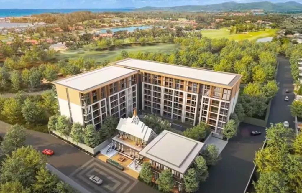 an artist rendering of a proposed apartment building at C240 New Prime Location 1BR Condo Near Beach Club in Thalang