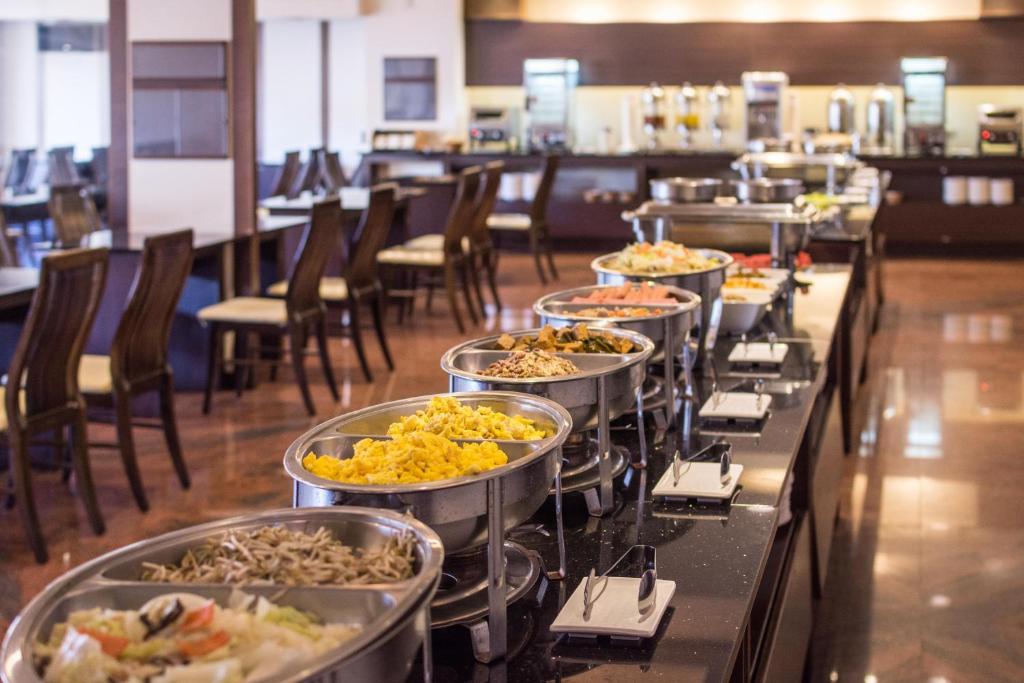 a buffet line with many trays of food at Twinstar Hotel in Taichung