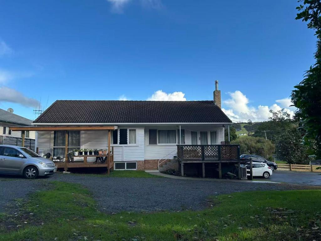 a house with a car parked in front of it at 13 Bedlington in Whangarei