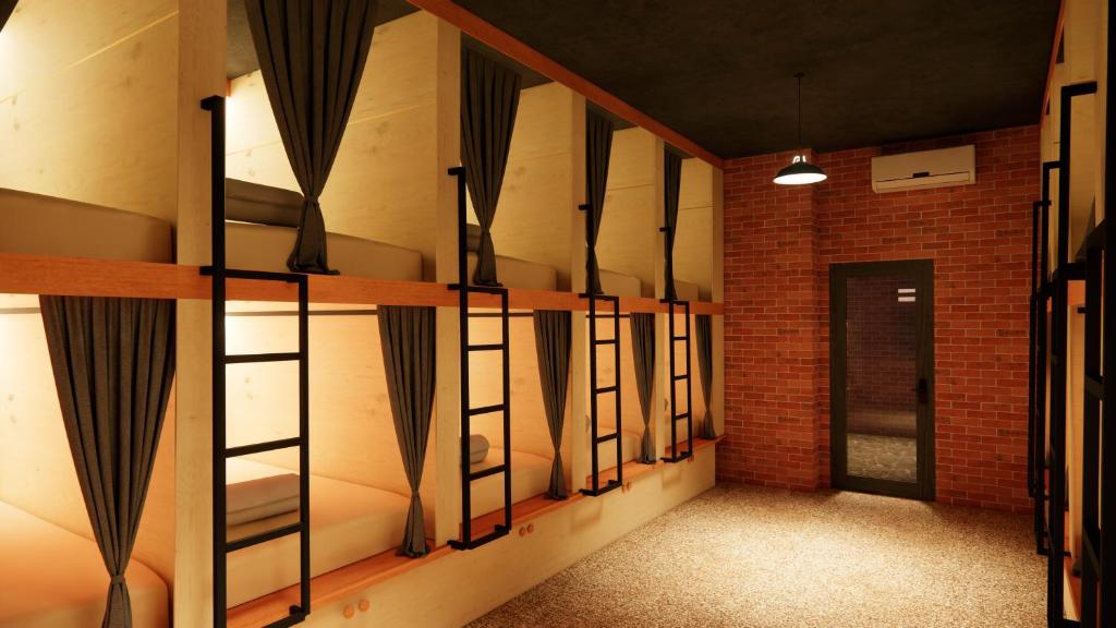 an empty room with black curtains on the wall at Mi Amor Luxury Hostel located in South Island Center in Phu Quoc