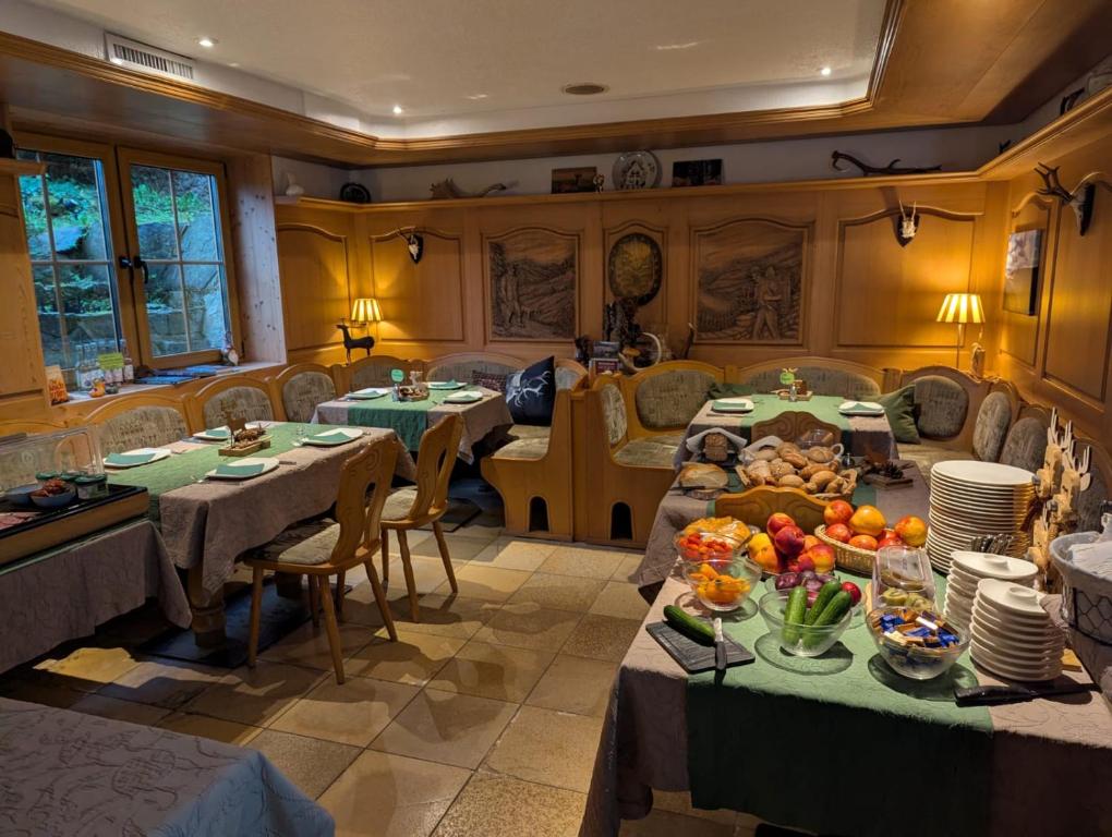 a living room with two tables with food on them at Jagdhaus Rech - Ahr in Rech