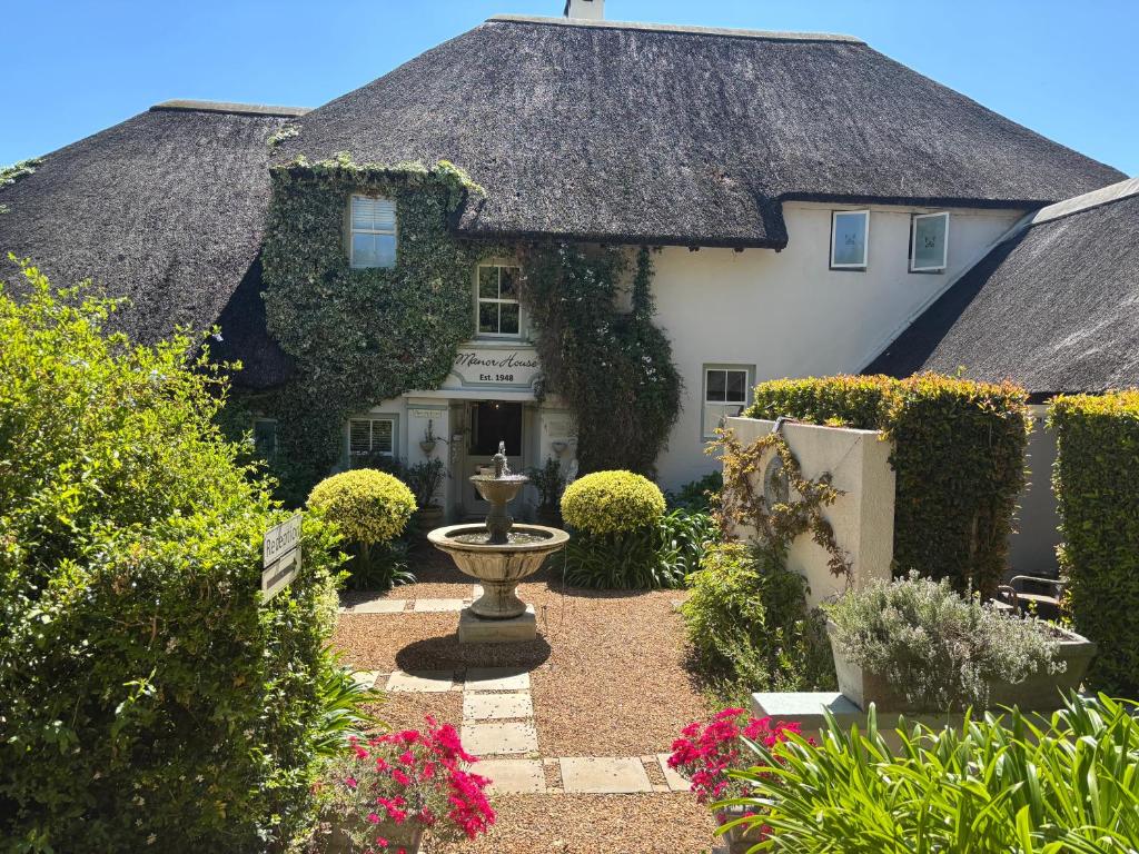 Κήπος έξω από το In the Vine Country Manor Guesthouse