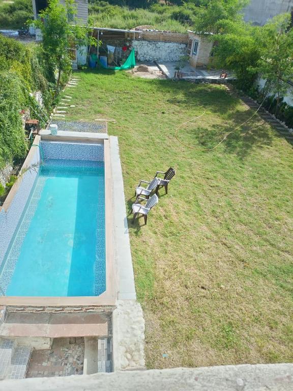 an overhead view of a swimming pool in a yard at Sukoon The Bliss!! in Udaipur