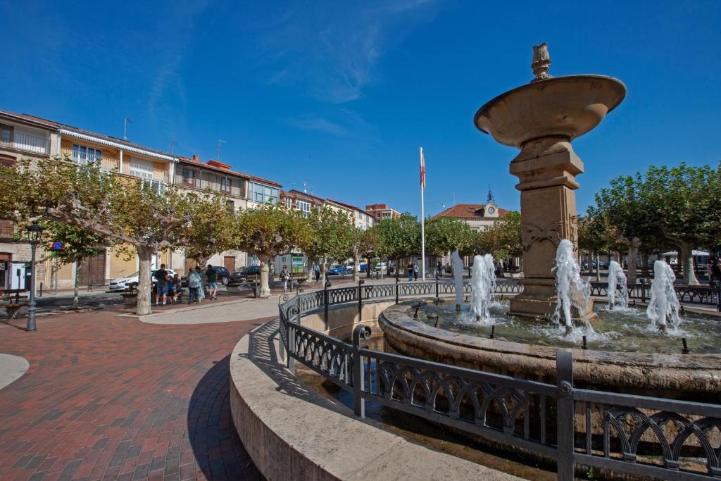 a fountain in the middle of a street at El Soto in Villarcayo