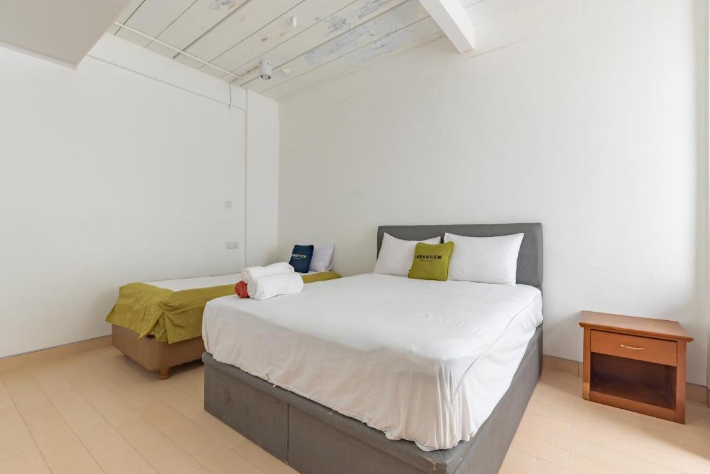 Giường trong phòng chung tại Urbanview Hotel Syariah at Rihlah Homestay Batam