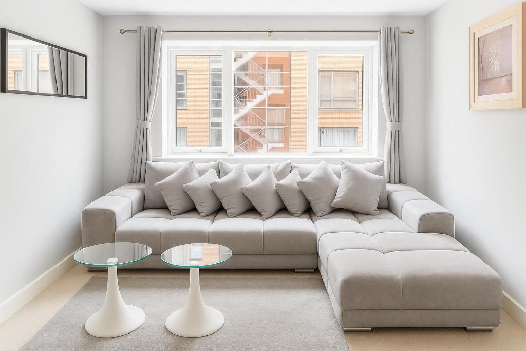 a living room with a couch and a table at 2 bedroom apartment Dublin 8 in Dublin