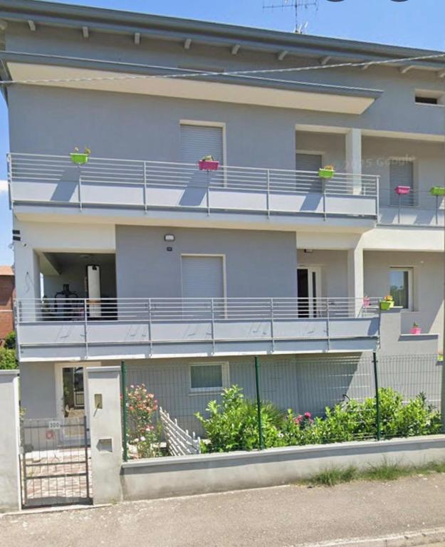 an apartment building with balconies and flowers on it at Madonna dell'ancora in Sassuolo