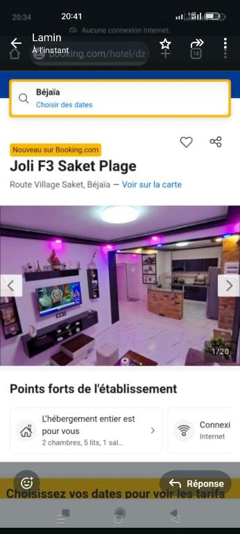 a page of a website with a tv in a room at Saket plage in Bejaïa