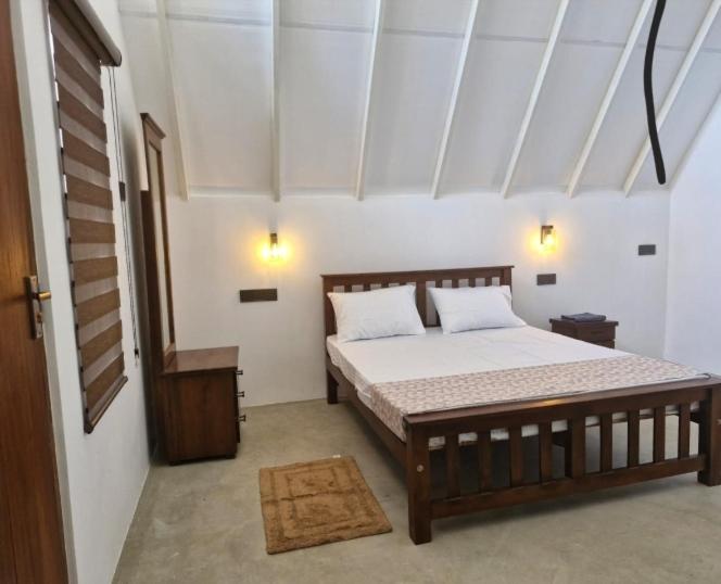 a bedroom with a large bed in a room at Pearl Crown Paradise room to rent Negombo in Negombo