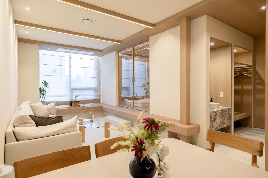a living room with a couch and a table at THE EXTAY Lounge Jongno in Seoul