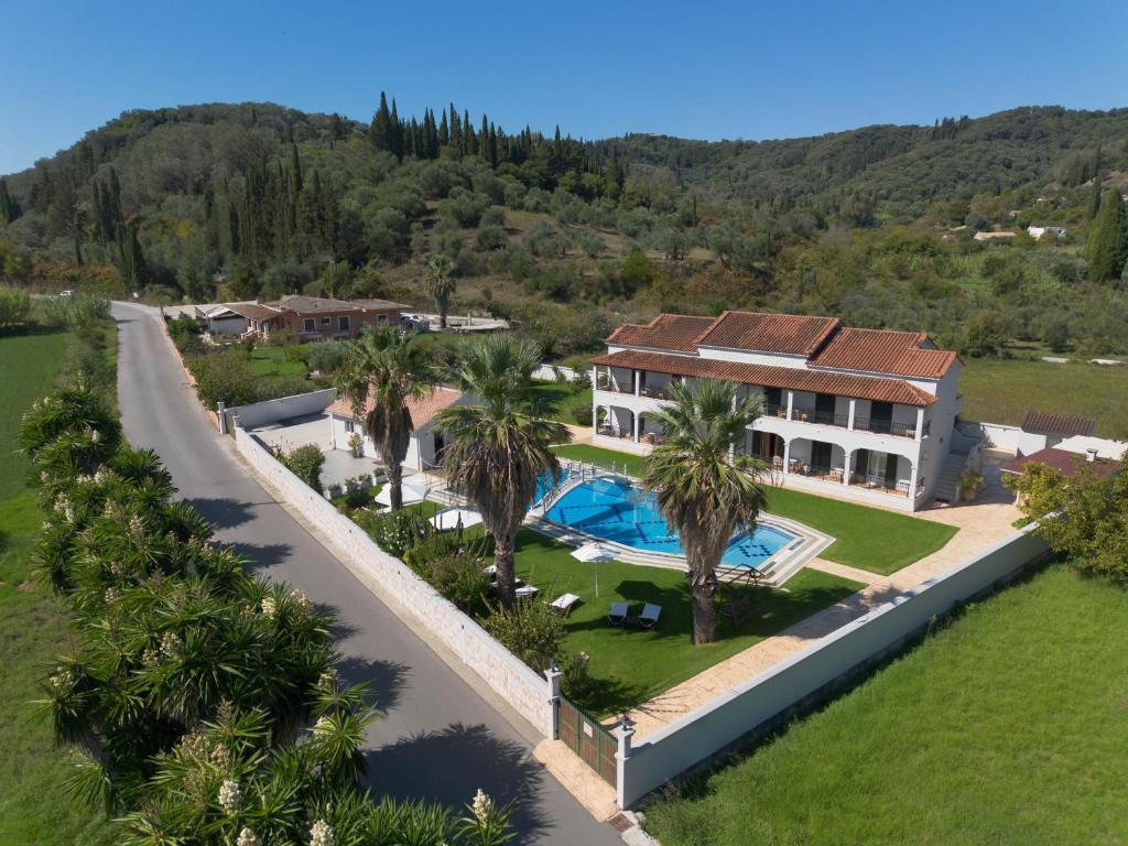 an aerial view of a house with a swimming pool at Dimitris Apartments in Sidari