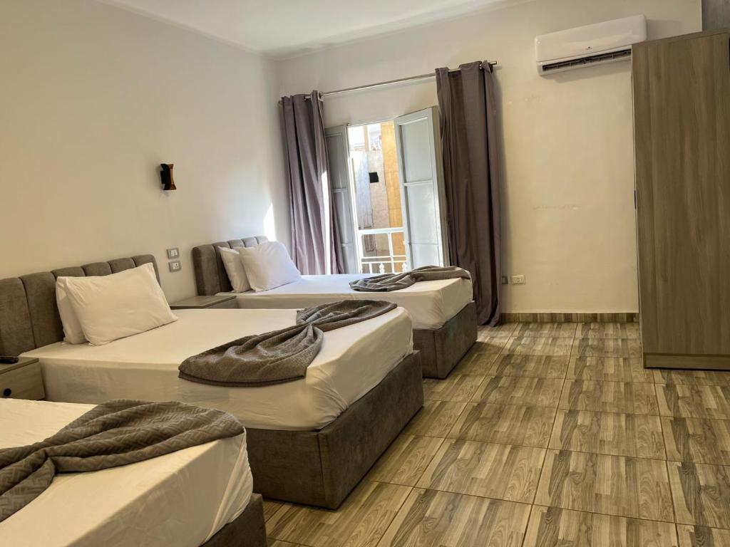 Ένα ή περισσότερα κρεβάτια σε δωμάτιο στο Downtown Cairo Park Plaza Hotel