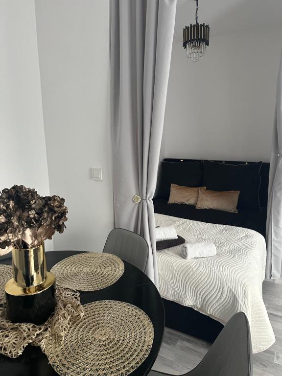 Postel nebo postele na pokoji v ubytování Royal Apartament