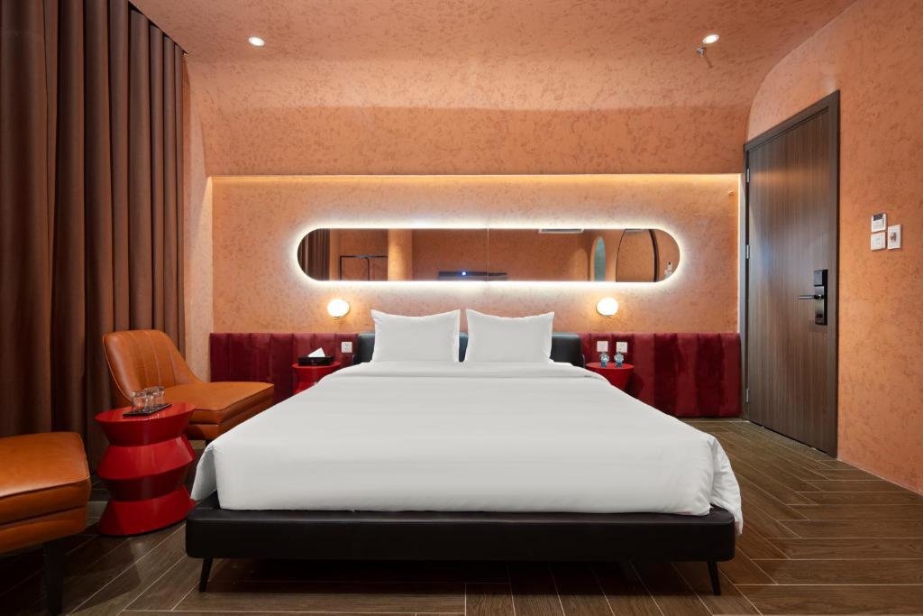 Postel nebo postele na pokoji v ubytování Jacayl Hotel - Hà Đông