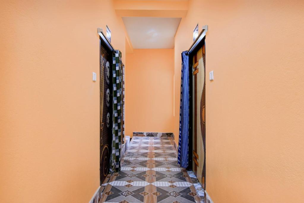 a corridor of a wine cellar with wine racks at OYO Flagship Hotel O Mo Kudia in Puri
