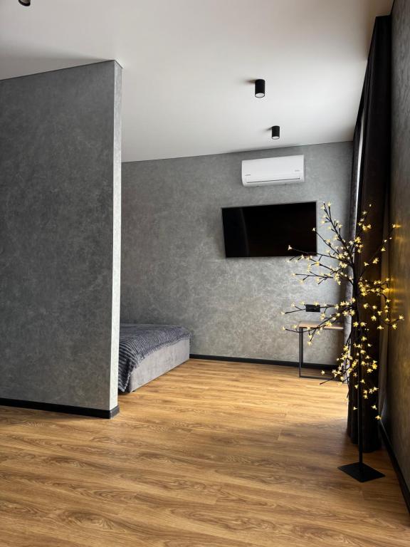 a room with a bed and a wall at Дизайнерські апартаменти в ЖК DreamTown in Luts'k