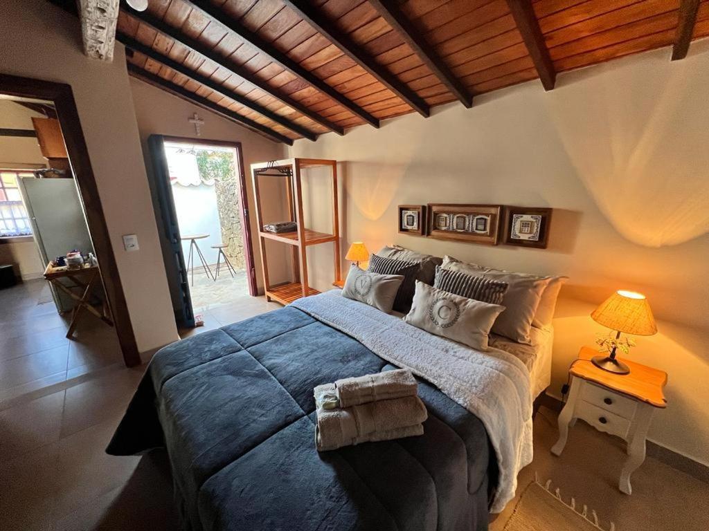 Ένα ή περισσότερα κρεβάτια σε δωμάτιο στο Casa no Centro Histórico