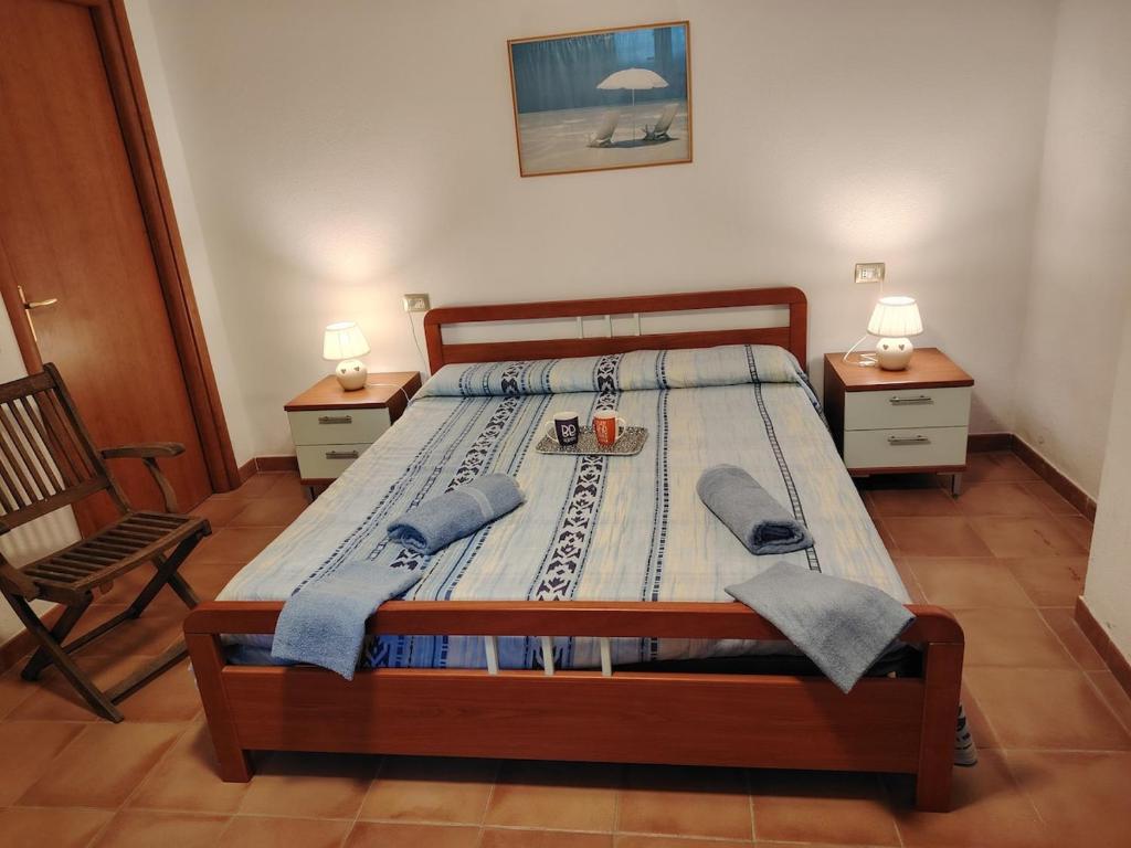 Ένα ή περισσότερα κρεβάτια σε δωμάτιο στο Sull'Onda di Buggerru