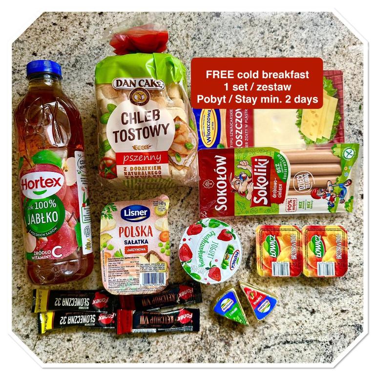 Hotel North Nest Luxury Suites, a group of food items laid out on a counter at North Nest Luxury Suites in Gdańsk