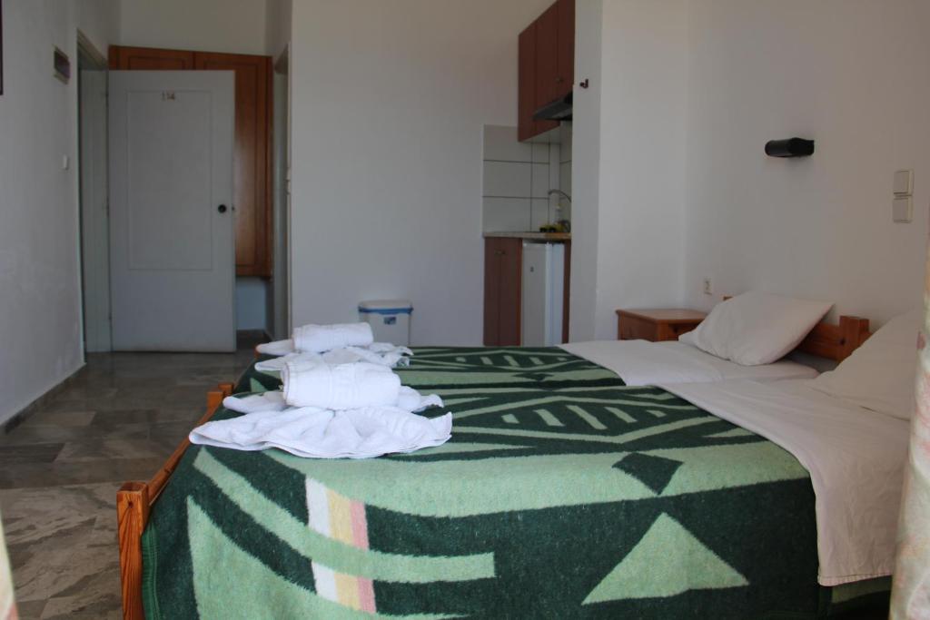 Postel nebo postele na pokoji v ubytování Hotel Alkyon