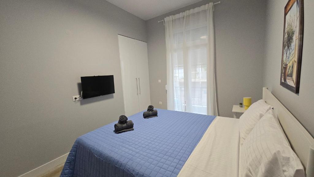 a bedroom with a bed with two animal heads on it at KYANA Luxury KVA in Kavala