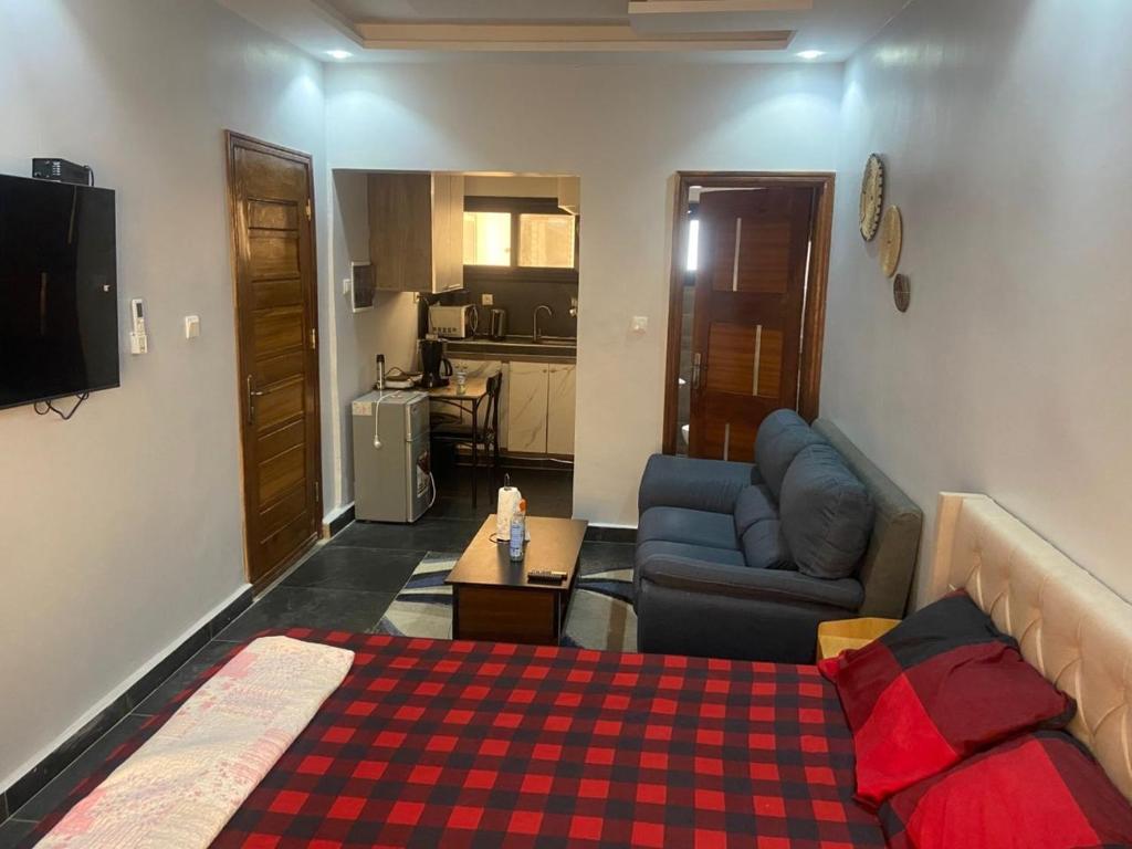 a living room with a bed and a couch at teranga in Dakar