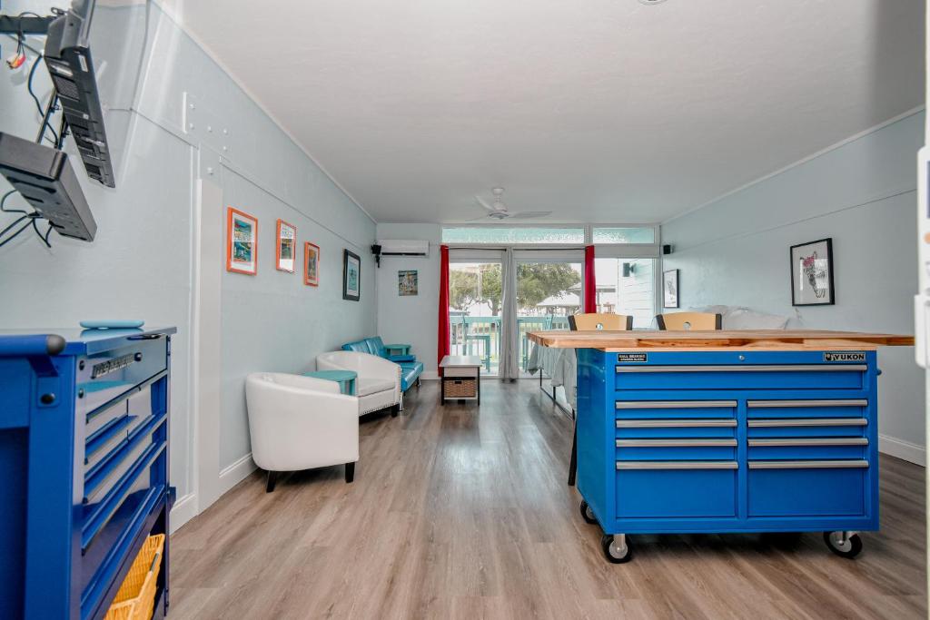 a room with a blue dresser in a room at Park Place Unit 129 in Cedar Key