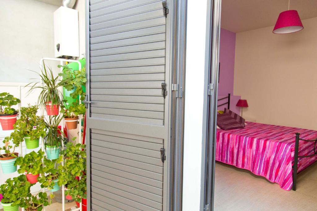 Łóżko lub łóżka w pokoju w obiekcie Appartamento Verde Taormina